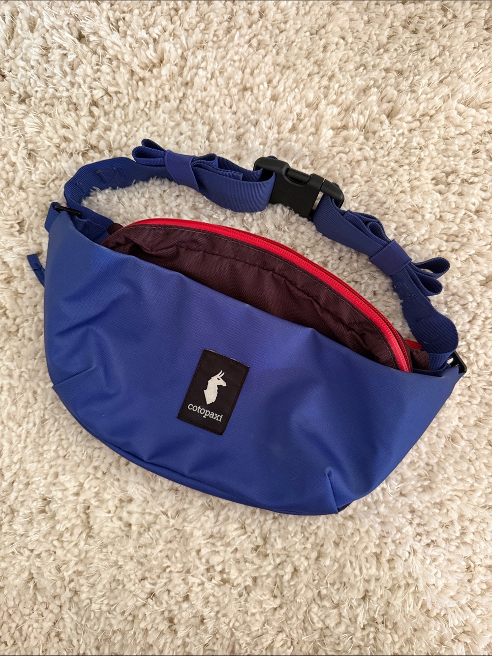 cotopaxi coso 2L cobalt blue belt bag with red zipper